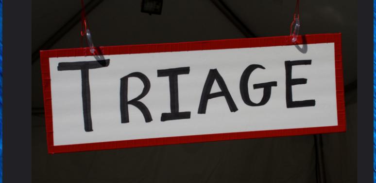 a slanted sign that says "triage"