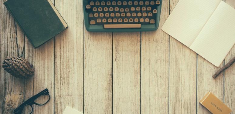 typewriter and writing book