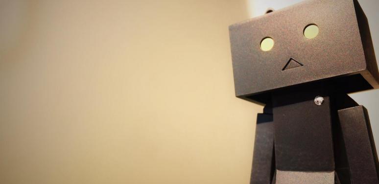 a robot character against a tan background