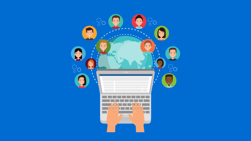 hands resting on laptop keyboard with heads of people arched over the top
