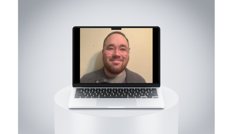 Picture of Kai Crawford visible on laptop screen
